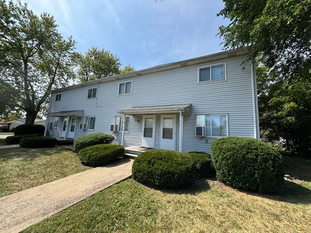a view of a house with a garden