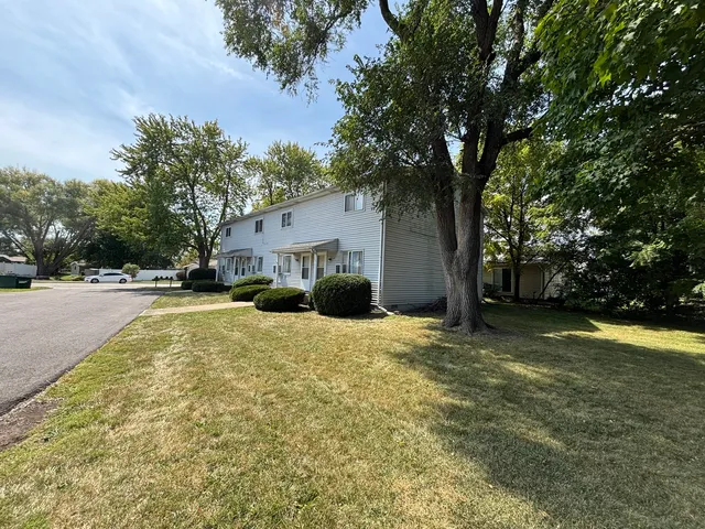 a house with trees in front of it