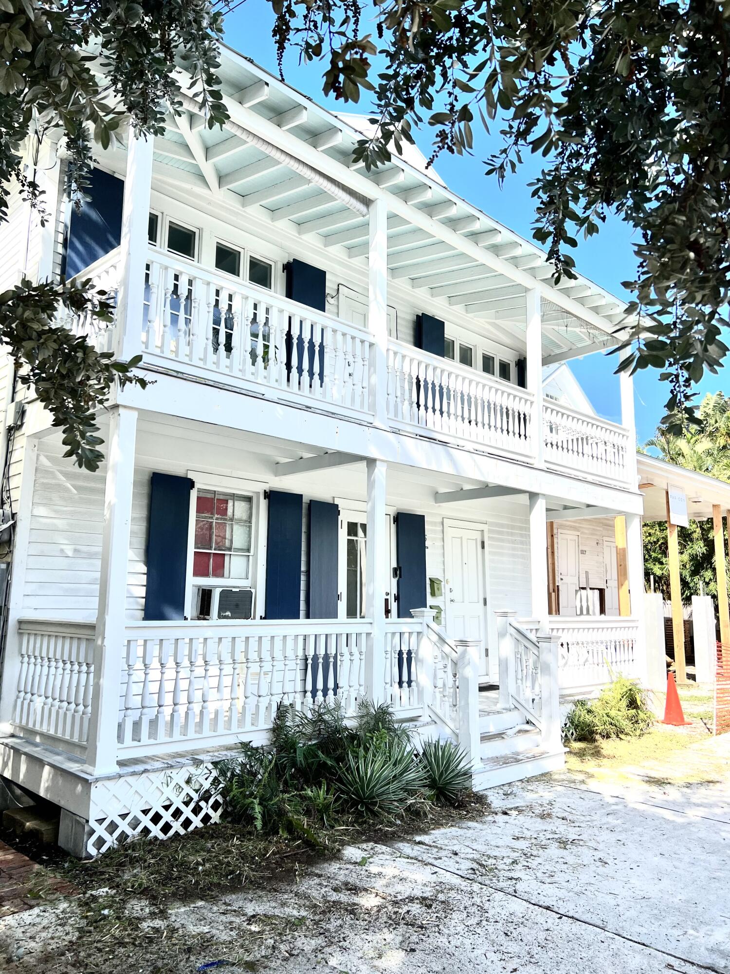 1115 Fleming Street Key West, FL 33040 - Photo 16 of 31 a front view of a white building with iron fence