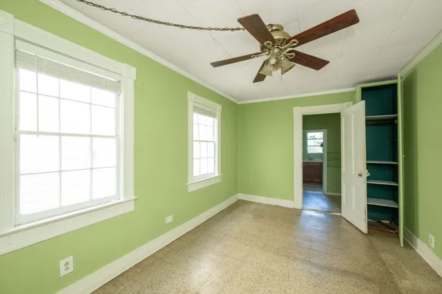 a view of an empty room with a window