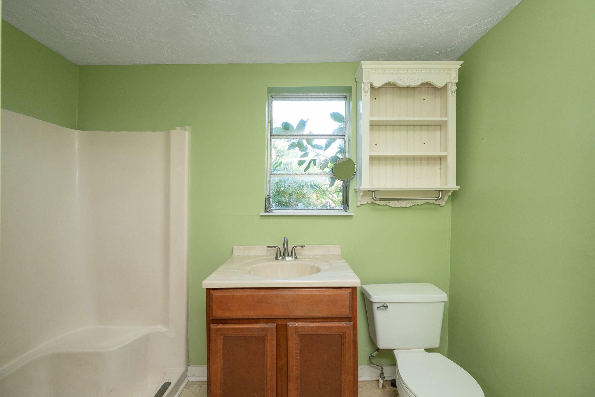 1115 Fleming Street Key West, FL 33040 - Photo 29 of 31 a bathroom with a toilet a sink and mirror