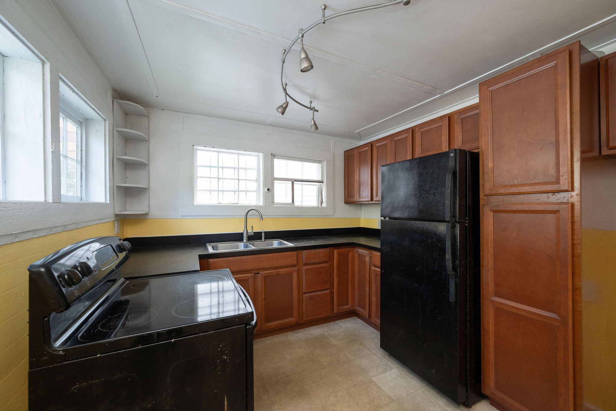 1115 Fleming Street Key West, FL 33040 - Photo 30 of 31 a kitchen with a refrigerator and a sink