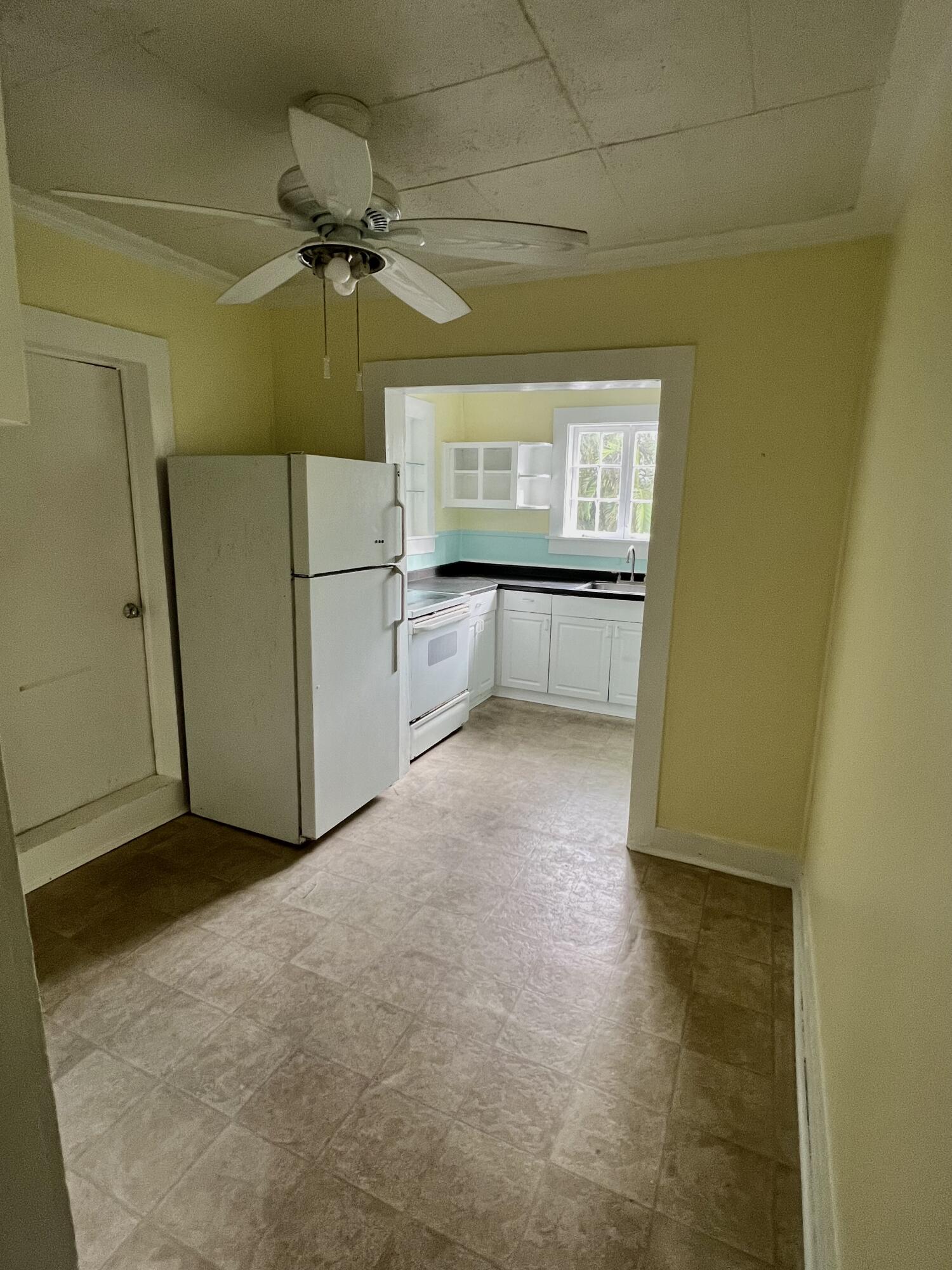 1115 Fleming Street Key West, FL 33040 - Photo 7 of 31 a view of an empty room with a window