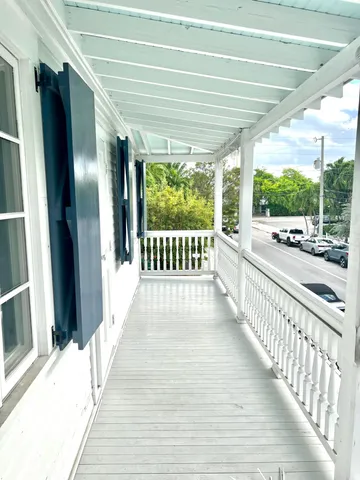 a view of a porch with wooden floor and outdoor space