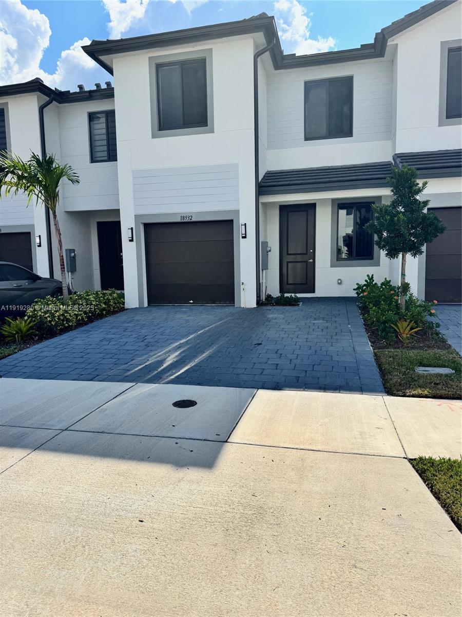 a front view of a house with yard
