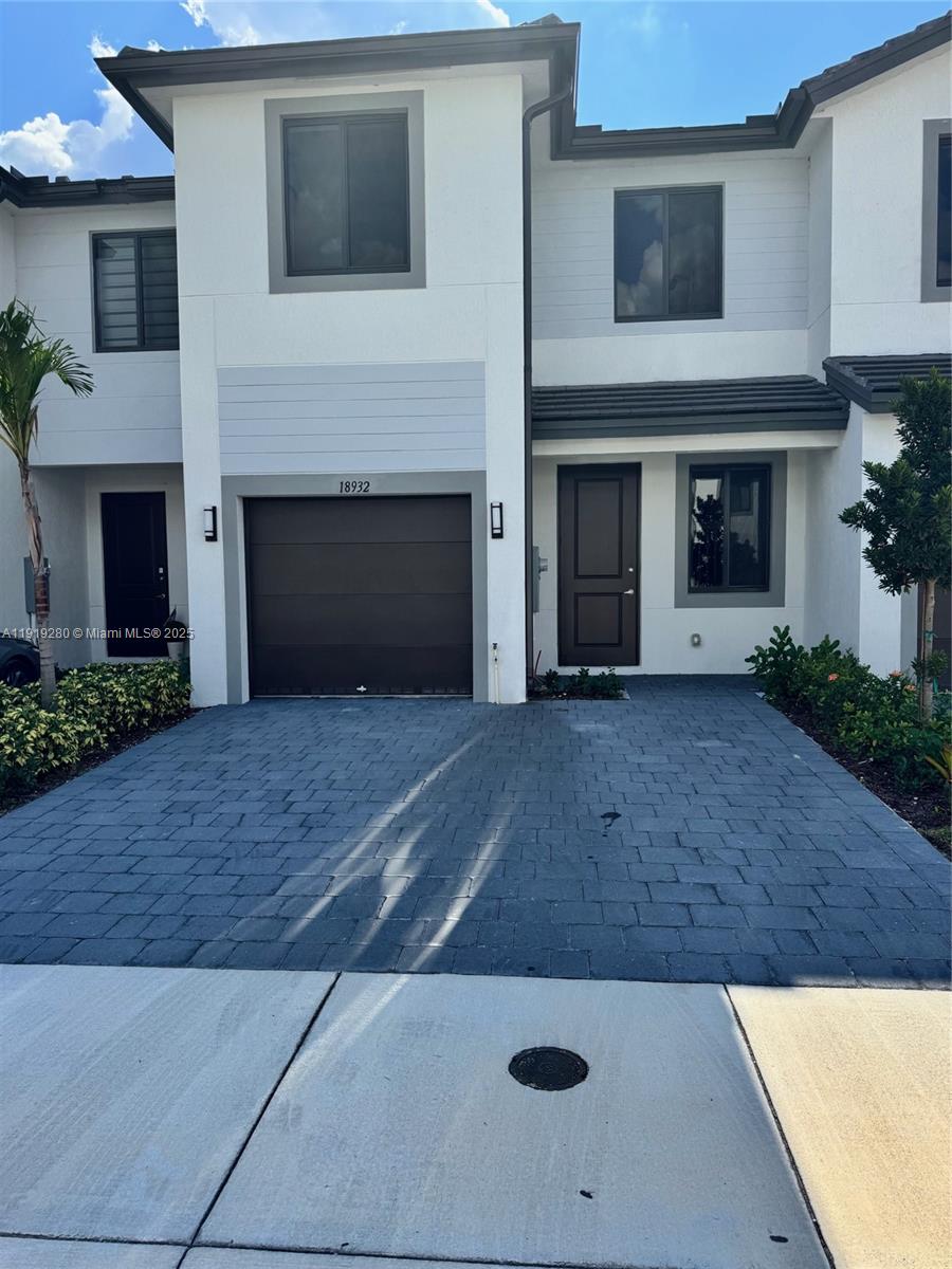 18932 Southwest 344th Terrace, Unit 18932 Homestead, FL 33034 - Photo 2 of 18 a view of a kitchen with a fireplace