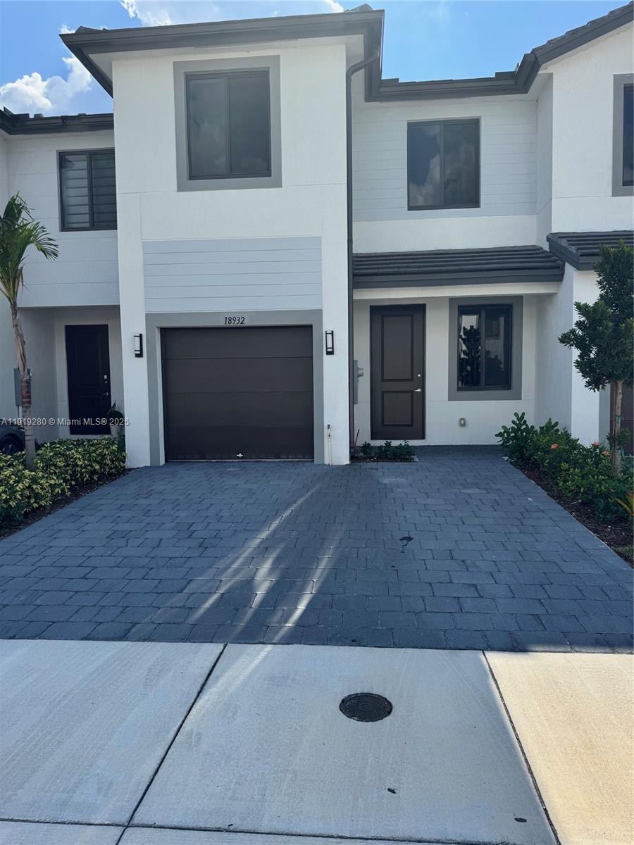 18932 Southwest 344th Terrace, Unit 18932 Homestead, FL 33034 - Photo 3 of 18 a view of a livingroom with a fireplace