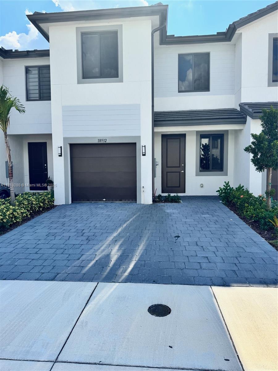 18932 Southwest 344th Terrace, Unit 18932 Homestead, FL 33034 - Photo 4 of 18 a view of a house with an outdoor space
