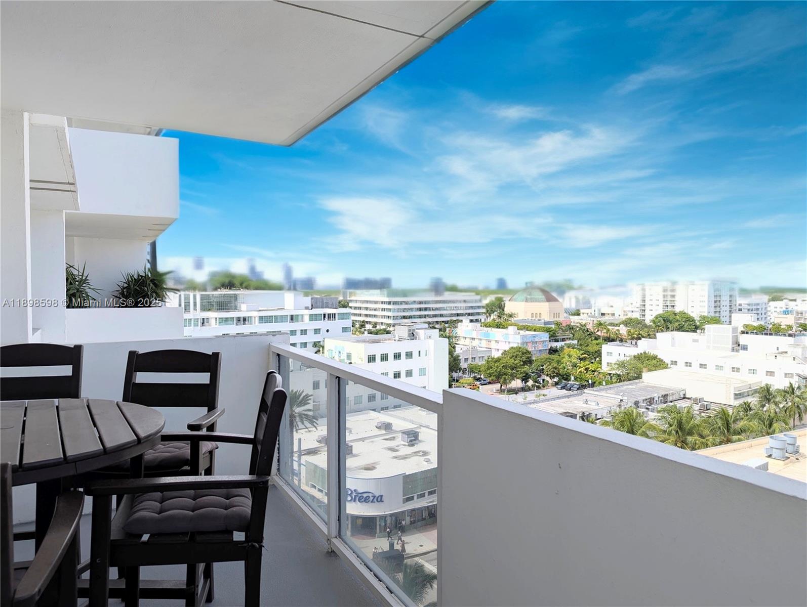 100 Lincoln Road, Unit 1008 Miami Beach, FL 33139 - Photo 12 of 13 a view of a balcony with chairs