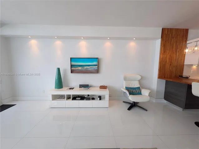 a living room with furniture and a night stand