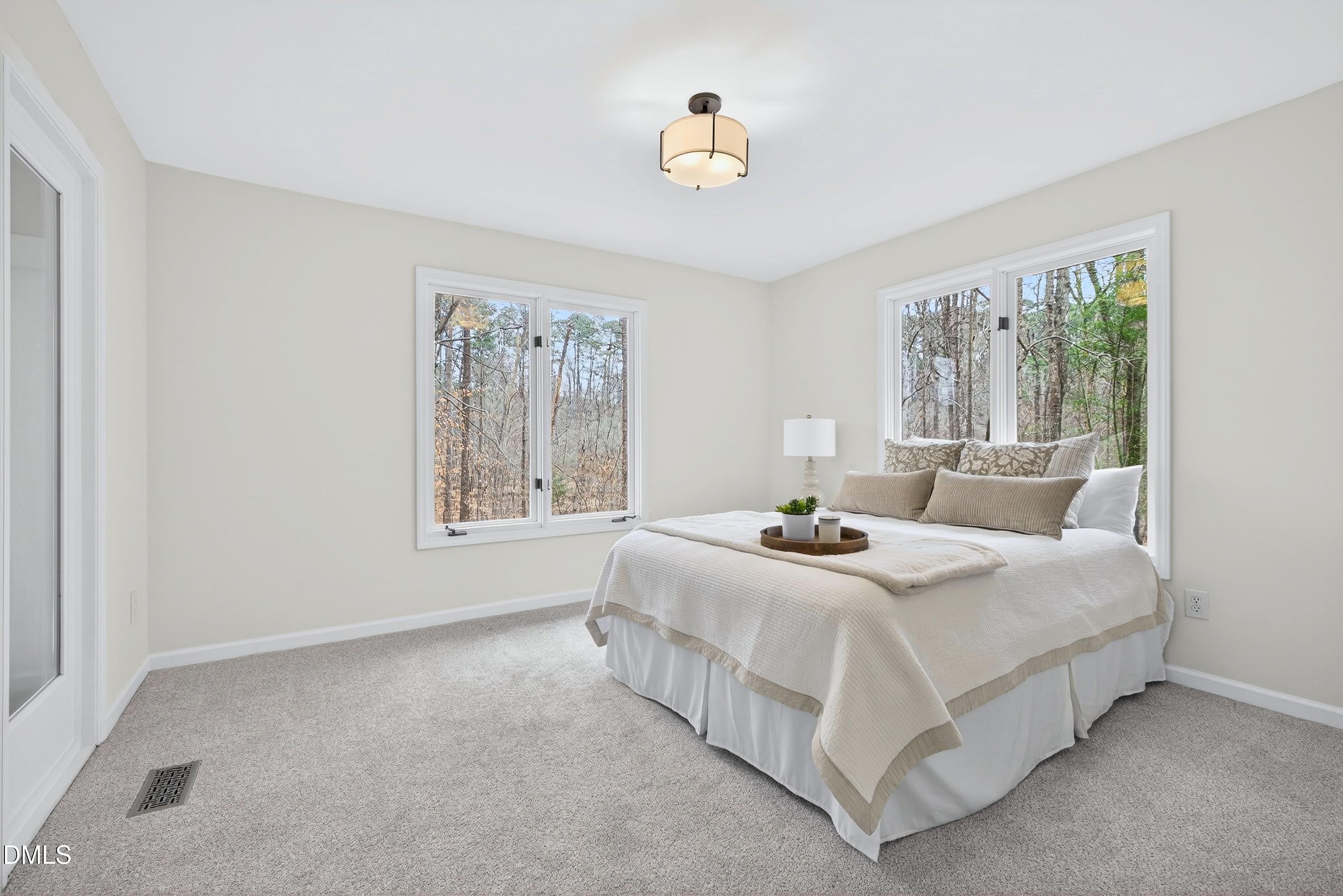 3304 Abney Place Raleigh, NC 27607 - Photo 38 of 55 This bedroom has views of the side and backyard with access to the sunroom. Large closet for storage