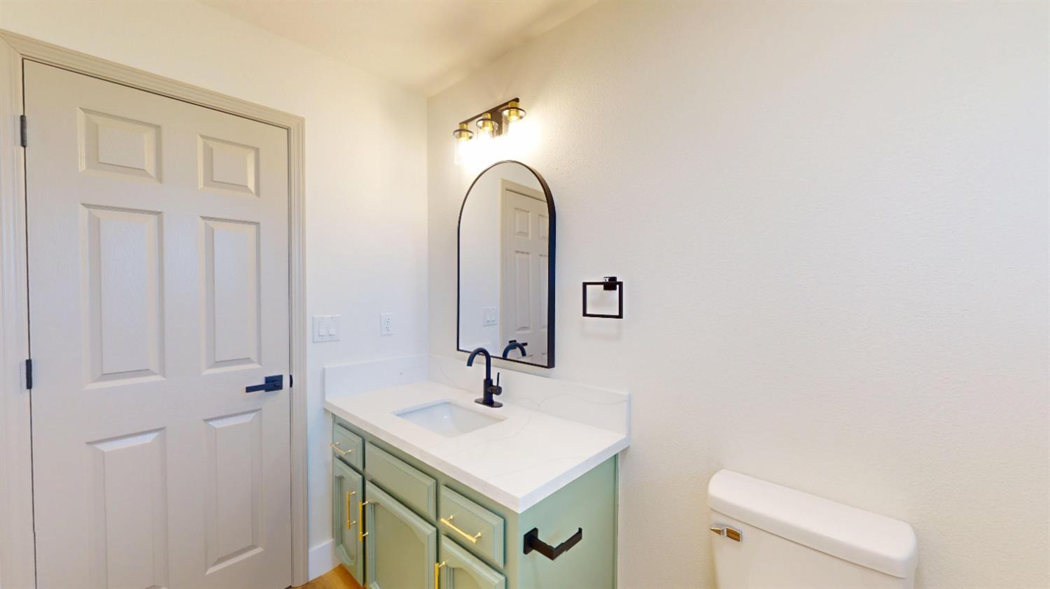 16363 Paula Road Madera, CA 93636 - Photo 17 of 29 a bathroom with a sink and a toilet