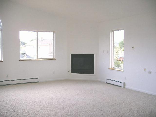 1557 Beech Street Rifle, CO 81650 - Photo 3 of 3 an empty room with windows