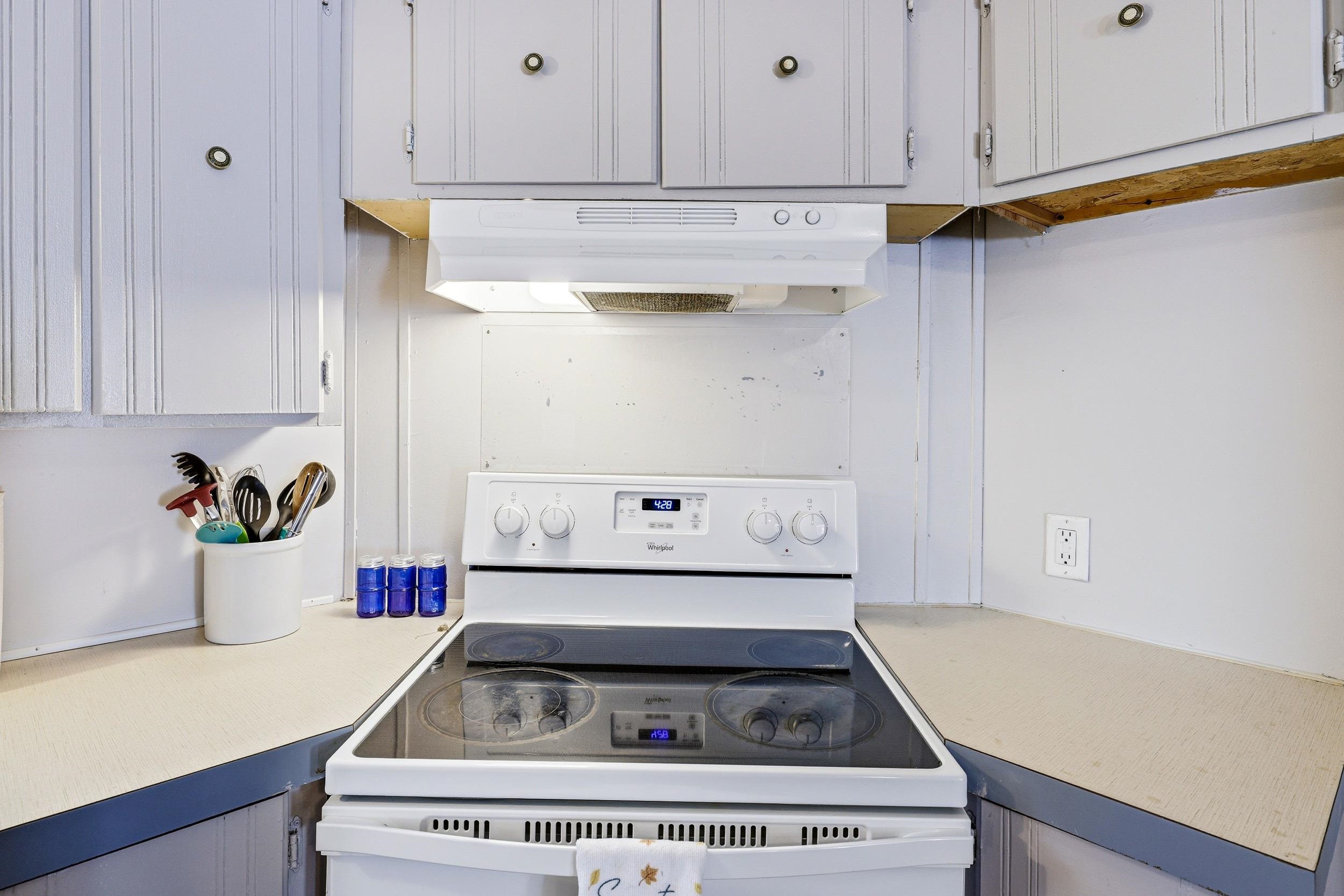 702 Richview Road Rileyville, VA 22650 - Photo 9 of 75 a white stove top oven sitting inside of a kitchen