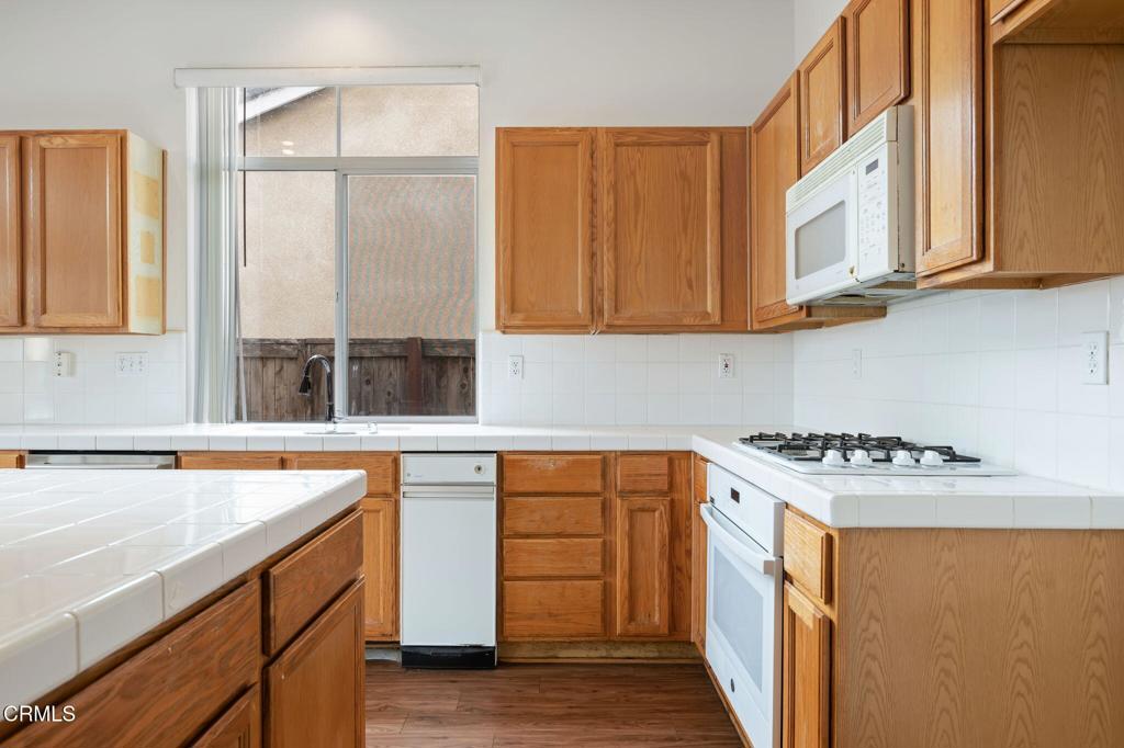 1930 Del Amo Way Oxnard, CA 93036 - Photo 16 of 31 a utility room with stainless steel appliances granite countertop a sink and a cabinets