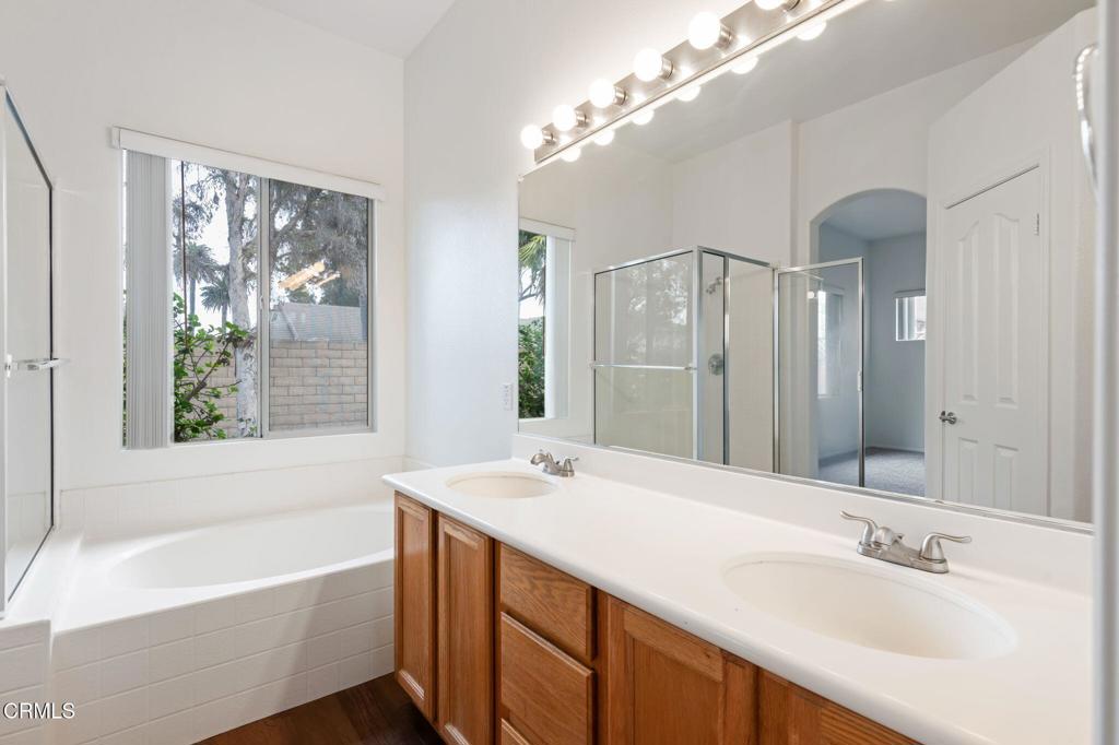 1930 Del Amo Way Oxnard, CA 93036 - Photo 22 of 31 a bathroom with a tub a sink and mirror