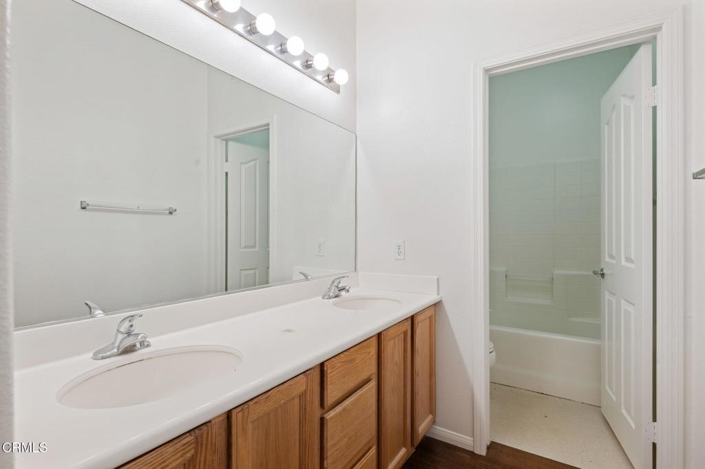 1930 Del Amo Way Oxnard, CA 93036 - Photo 25 of 31 a bathroom with a sink double vanity and a mirror