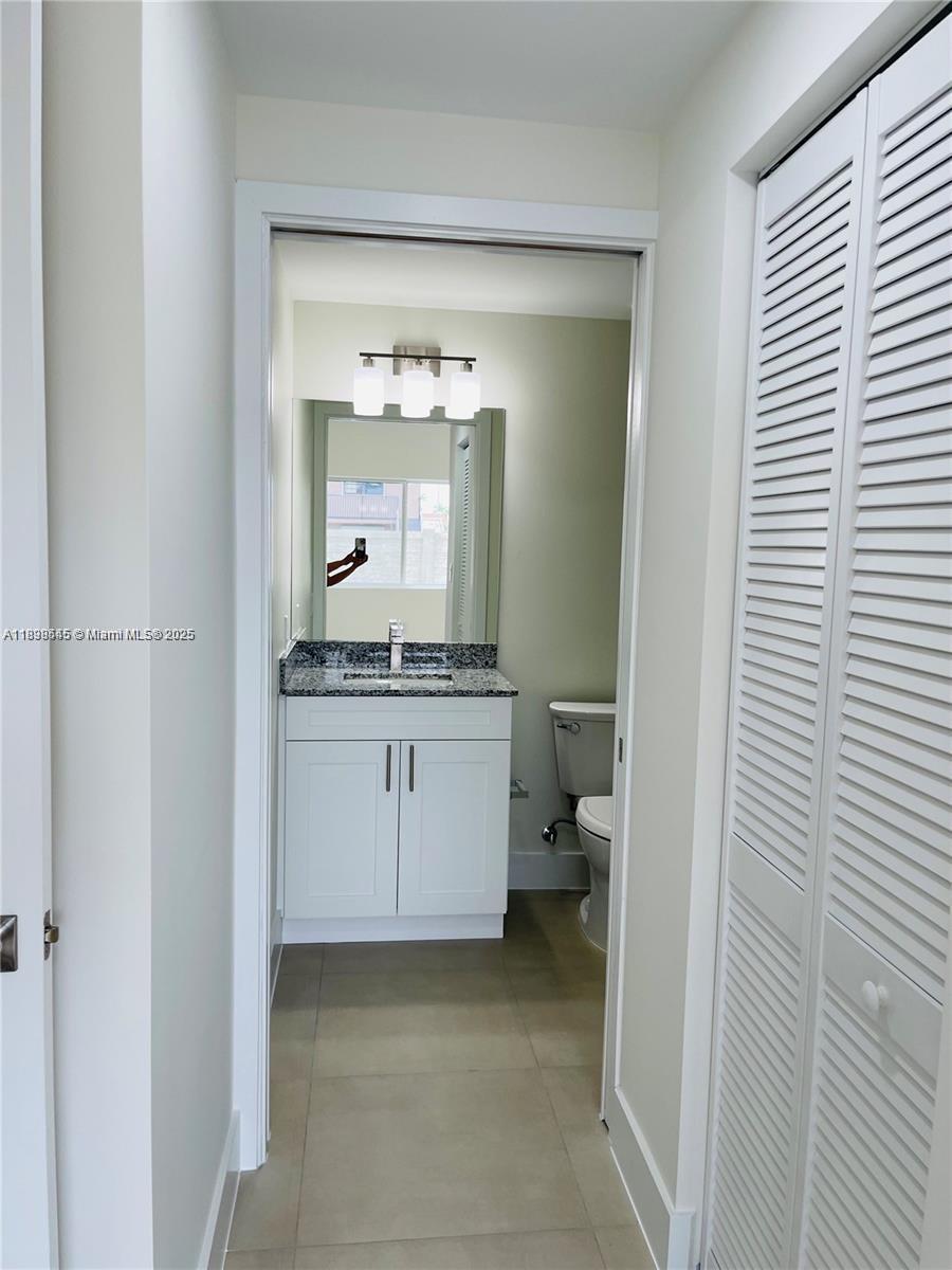 310 East 7th Street, Unit 204 Hialeah, FL 33010 - Photo 11 of 13 a bathroom with a sink and a mirror