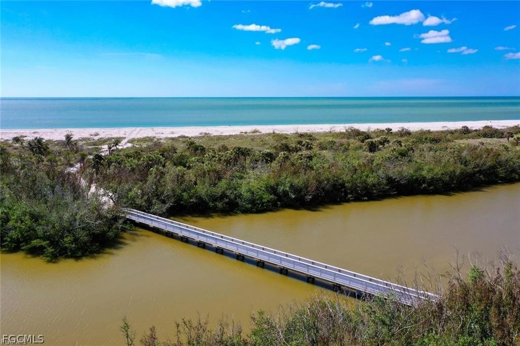 5117 Sea Bell Road, Unit F206 Sanibel, FL 33957 - Photo 11 of 47 a view of an ocean and beach