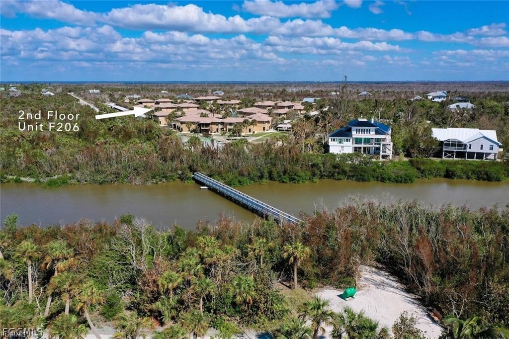 5117 Sea Bell Road, Unit F206 Sanibel, FL 33957 - Photo 12 of 47 an aerial view of residential building and lake