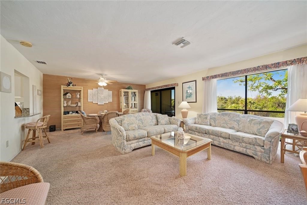 5117 Sea Bell Road, Unit F206 Sanibel, FL 33957 - Photo 20 of 47 a living room with furniture and a large window