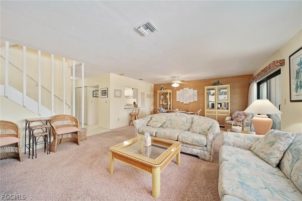 5117 Sea Bell Road, Unit F206 Sanibel, FL 33957 - Photo 22 of 47 a living room with furniture and a lamp