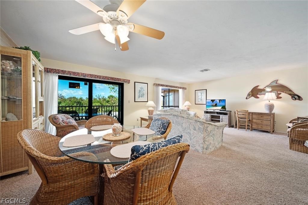 5117 Sea Bell Road, Unit F206 Sanibel, FL 33957 - Photo 24 of 47 a view of a dining room with furniture window and outside view