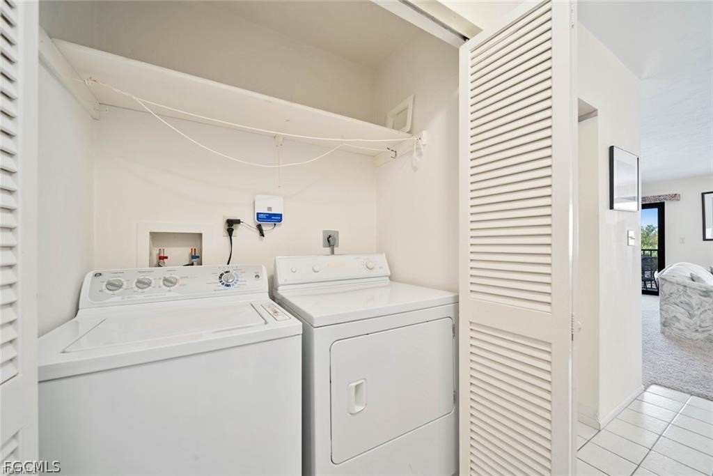 5117 Sea Bell Road, Unit F206 Sanibel, FL 33957 - Photo 34 of 47 a utility room with dryer and washer