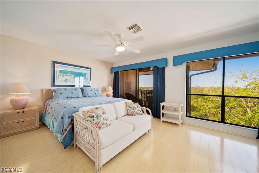 5117 Sea Bell Road, Unit F206 Sanibel, FL 33957 - Photo 38 of 47 a spacious bedroom with a large bed and a large window