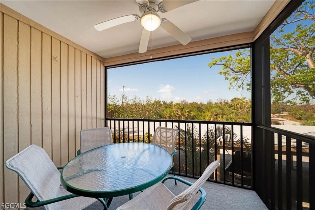 5117 Sea Bell Road, Unit F206 Sanibel, FL 33957 - Photo 47 of 47 a balcony with table and chairs