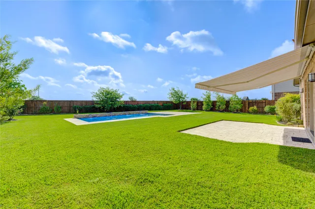 a view of outdoor space yard and swimming pool