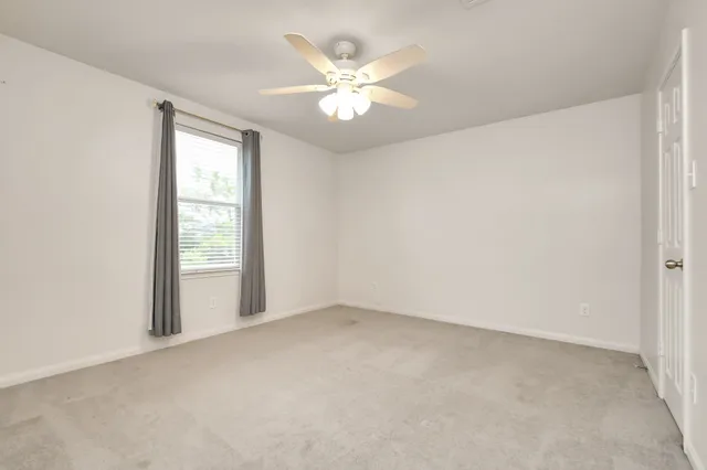 a view of a backyard with table and chairs
