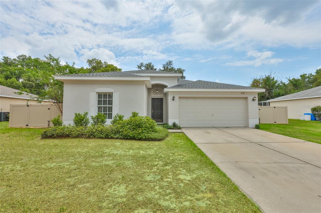 708 Coade Stone Drive Seffner, FL 33584 - Photo 40 of 48 front view of house with a yard