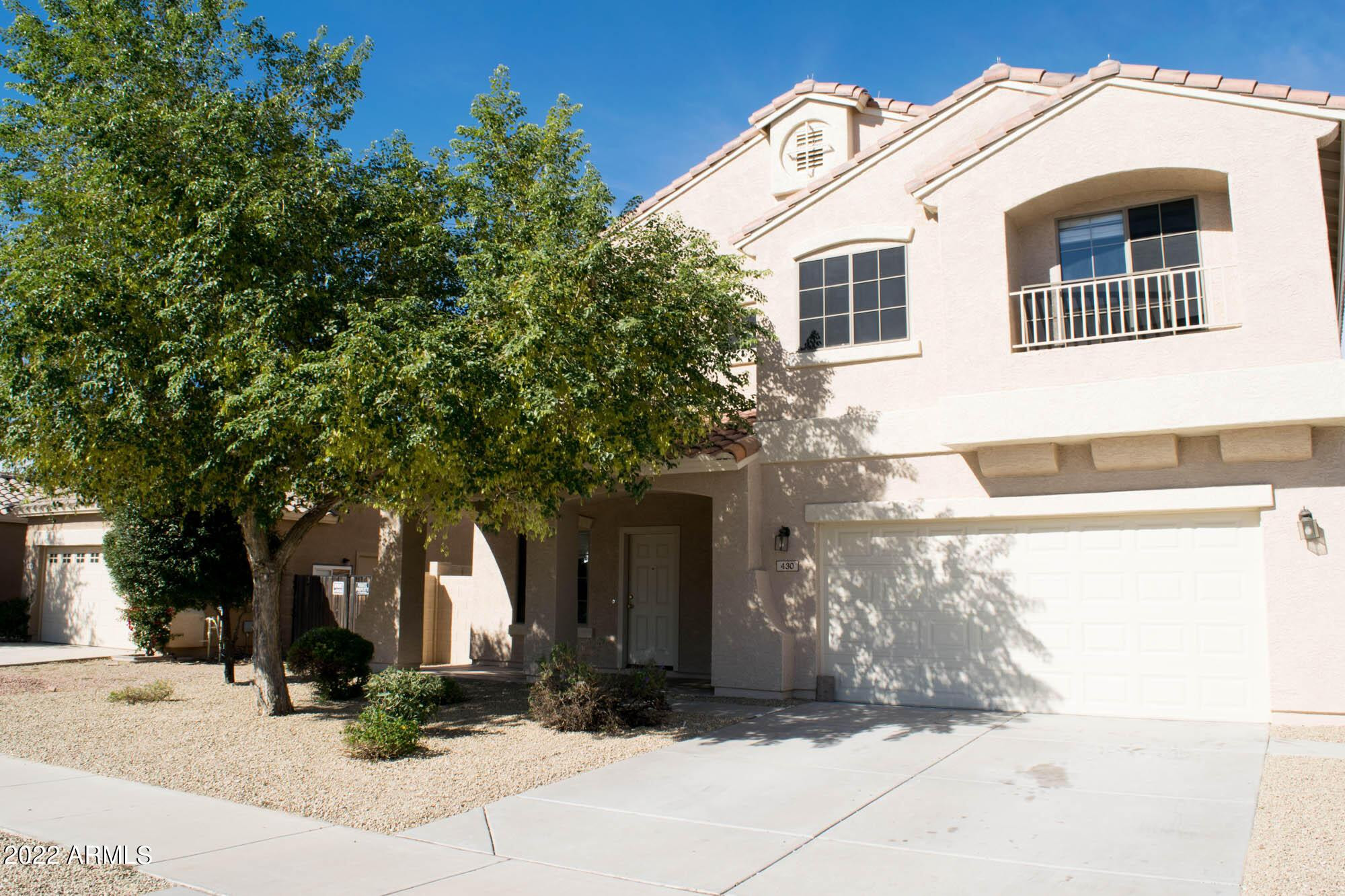 430 South 166th Avenue Goodyear, AZ 85338 - Photo 1 of 17 a front view of a house with yard