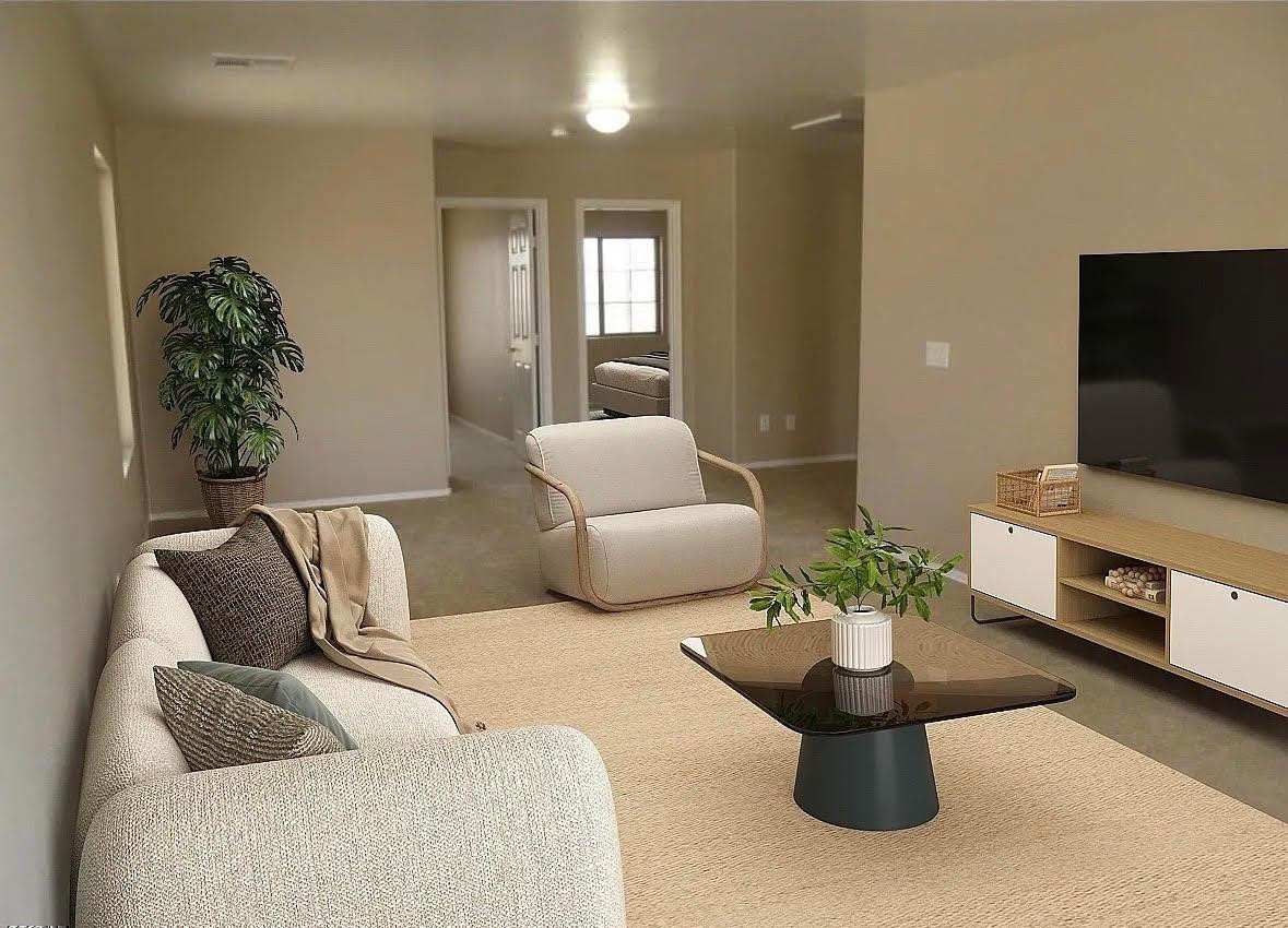 430 South 166th Avenue Goodyear, AZ 85338 - Photo 5 of 17 a living room with furniture and a flat screen tv