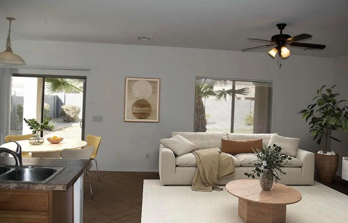 430 South 166th Avenue Goodyear, AZ 85338 - Photo 6 of 17 a living room with furniture and a large window