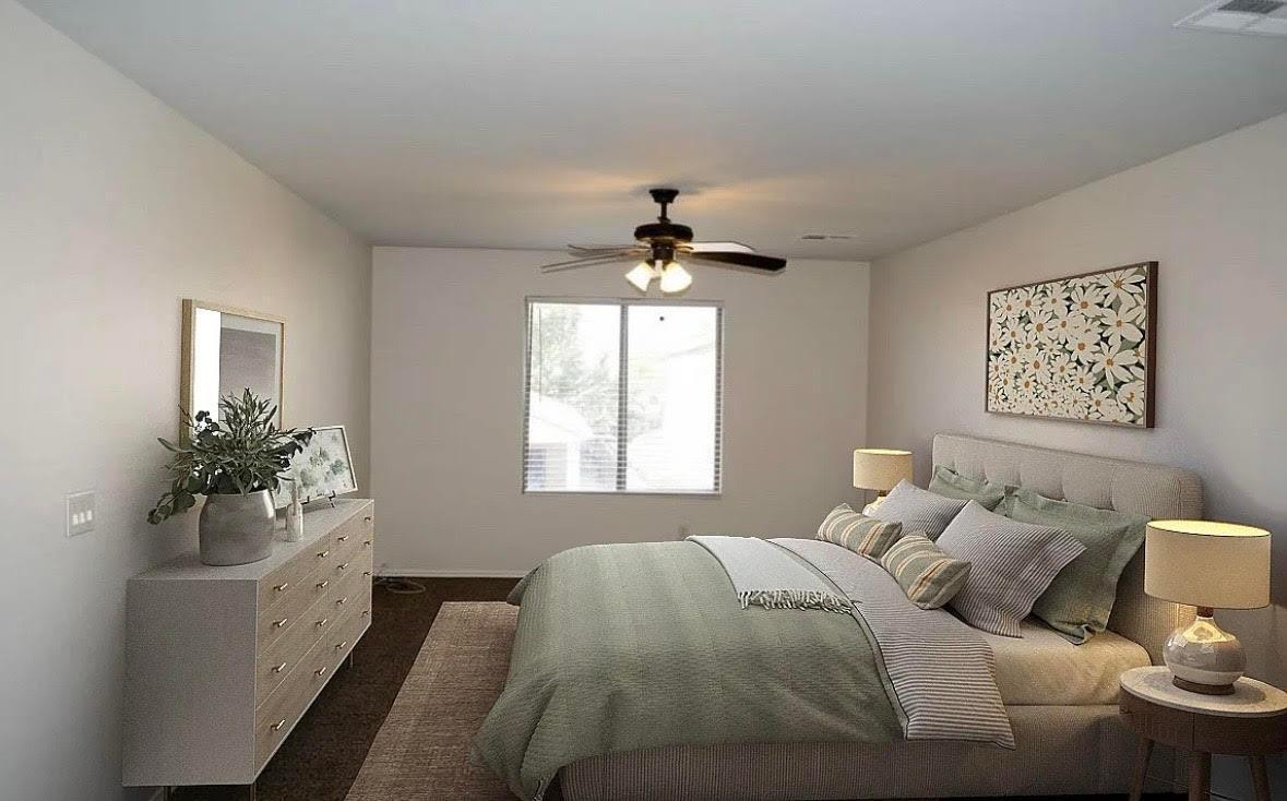 430 South 166th Avenue Goodyear, AZ 85338 - Photo 7 of 17 a bedroom with a bed and a window