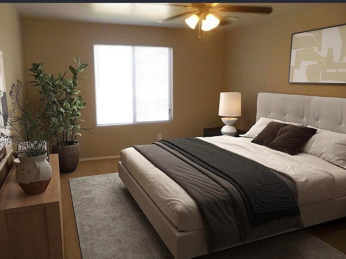 430 South 166th Avenue Goodyear, AZ 85338 - Photo 9 of 17 a bedroom with a bed and a potted plant
