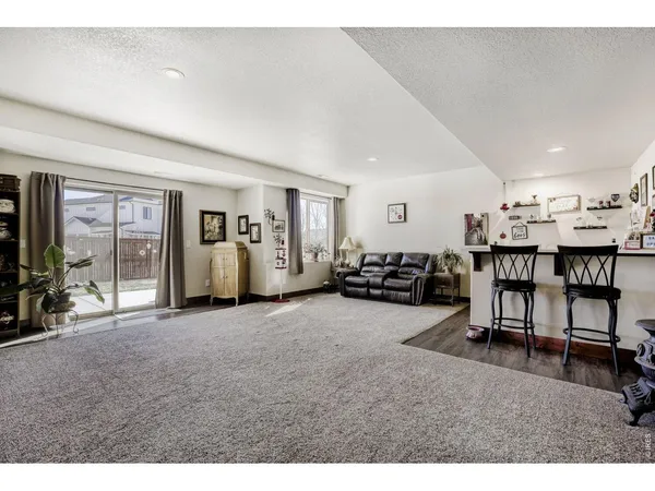 a living room with lots of furniture and lots of furniture