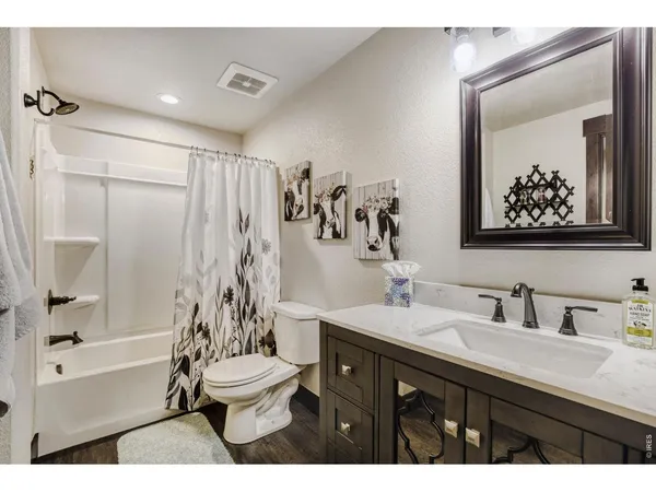 a bathroom with a sink a toilet and a bathtub