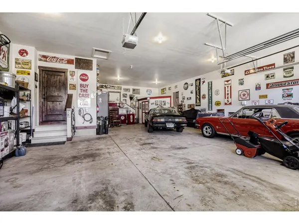 a view of cars parked in a parking room