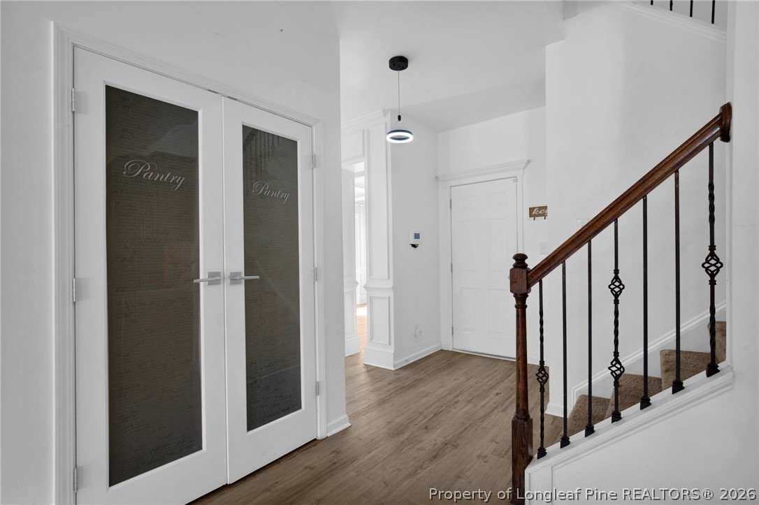 2145 Harrington Road Fayetteville, NC 28306 - Photo 24 of 50 a view of a hallway with wooden floor and staircase