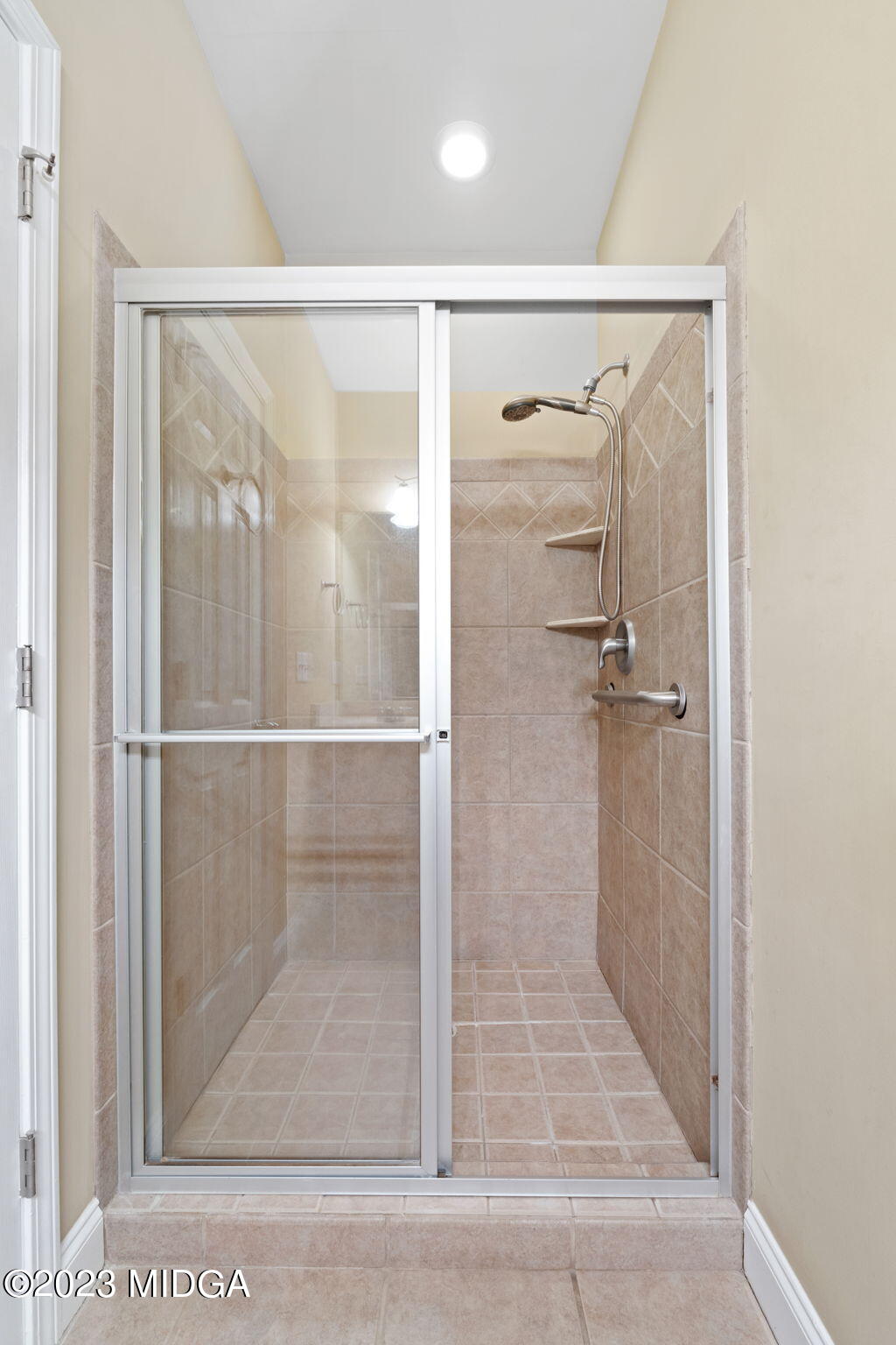 268 Godsey Road Jackson, GA 30233 - Photo 32 of 58 a bathroom with a glass shower door