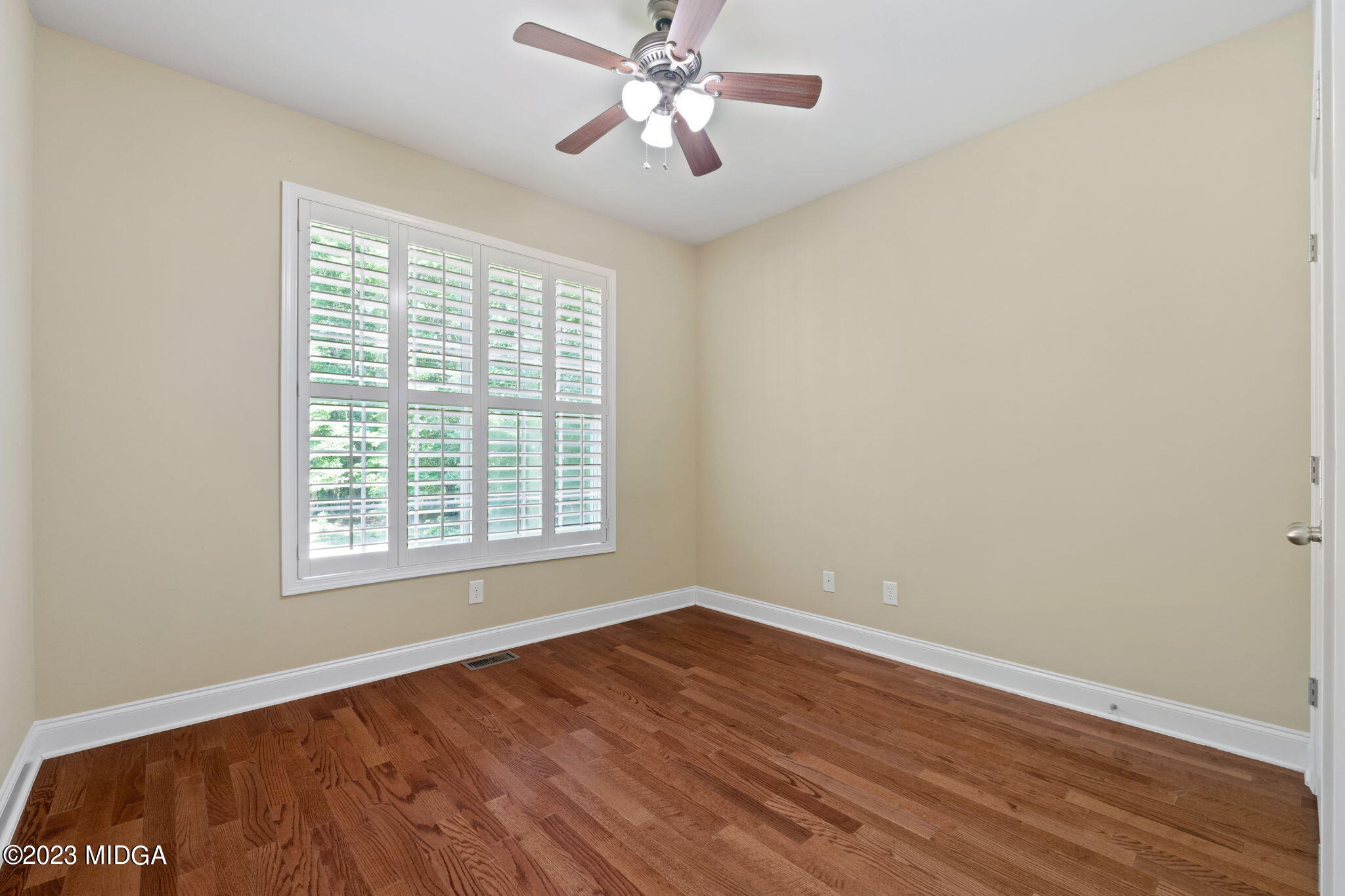 268 Godsey Road Jackson, GA 30233 - Photo 36 of 58 a view of an empty room with wooden floor and a window