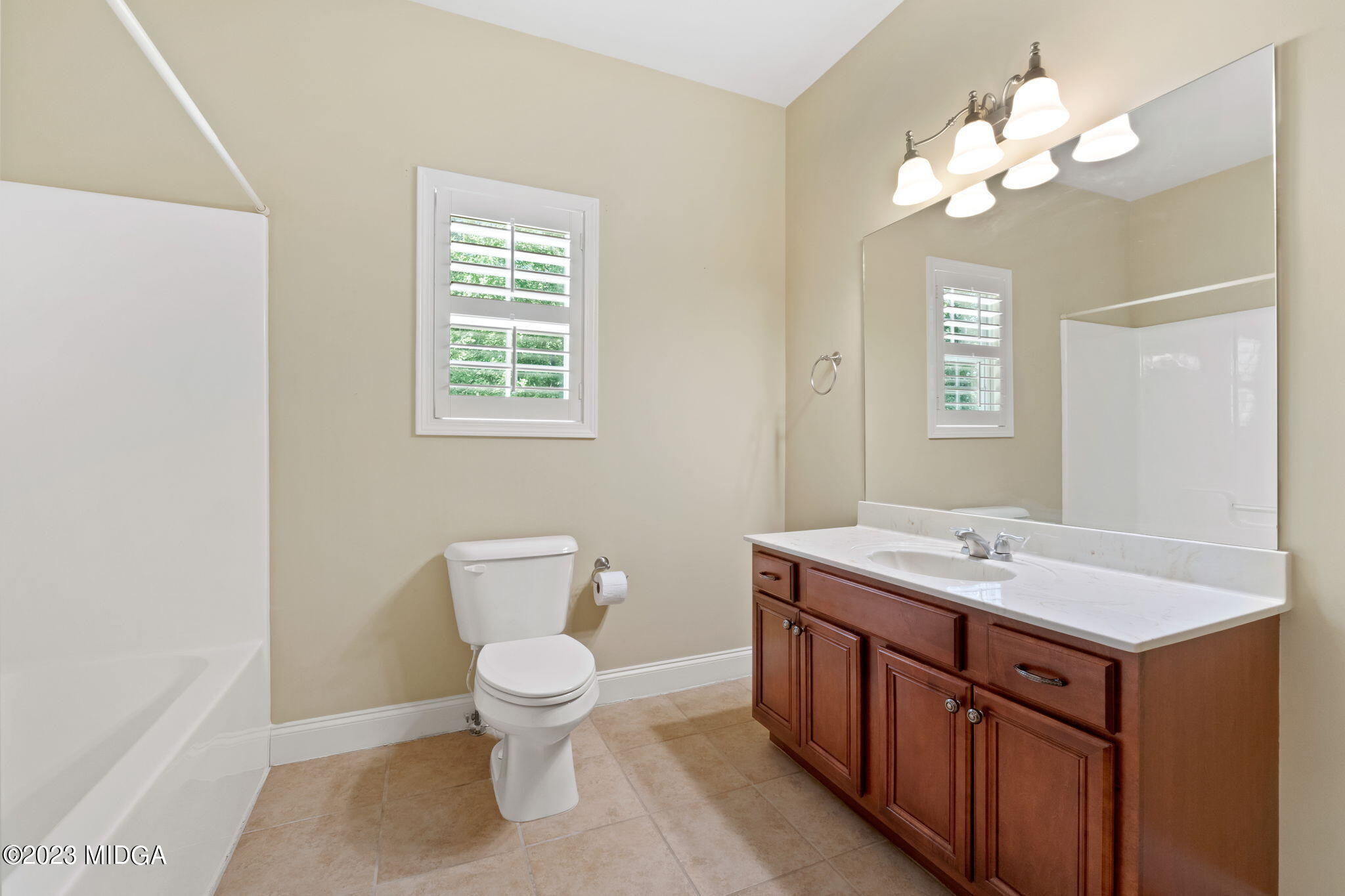 268 Godsey Road Jackson, GA 30233 - Photo 44 of 58 a bathroom with a toilet sink and mirror