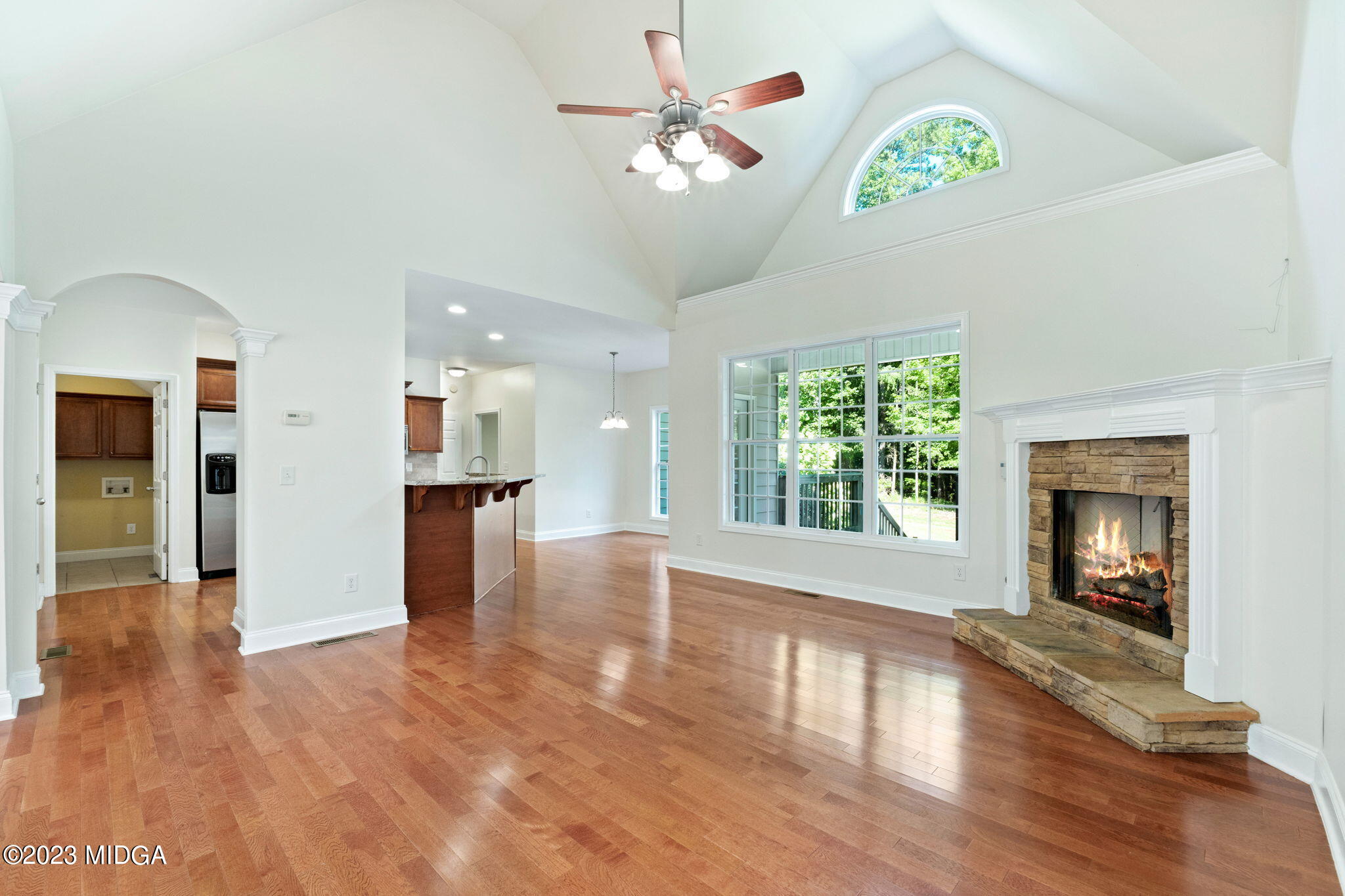 268 Godsey Road Jackson, GA 30233 - Photo 6 of 58 a view of an empty room with window and wooden floor