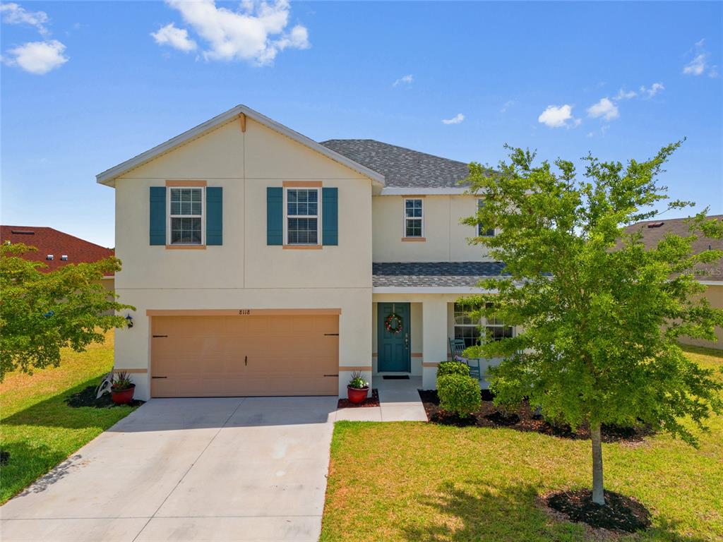 a view of a house with a yard