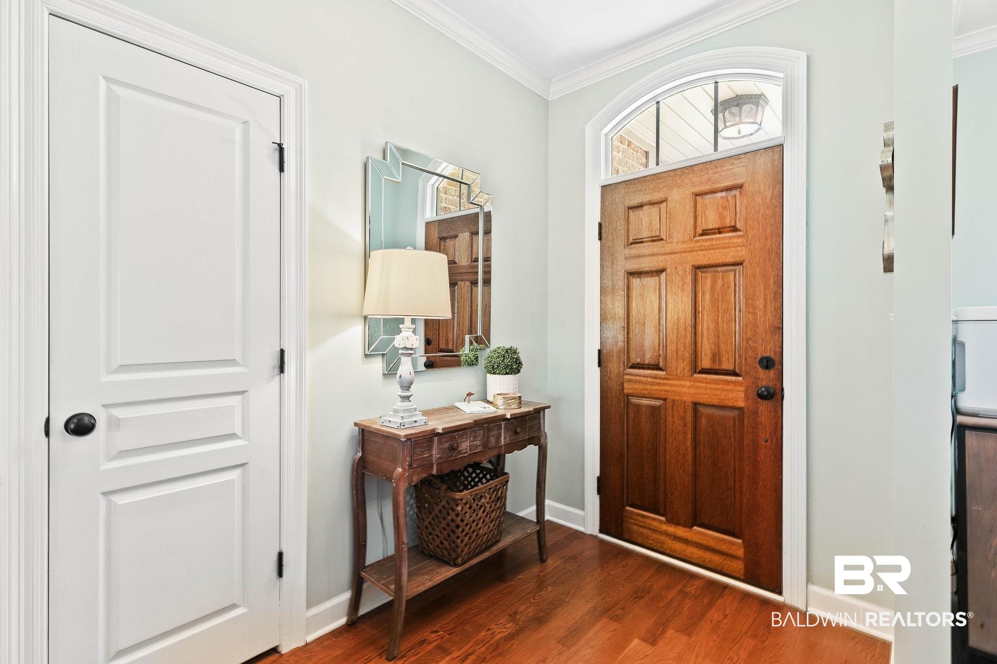 9522 Sanibel Loop Daphne, AL 36526 - Photo 8 of 43 Entryway featuring dark wood finished floors and crown molding