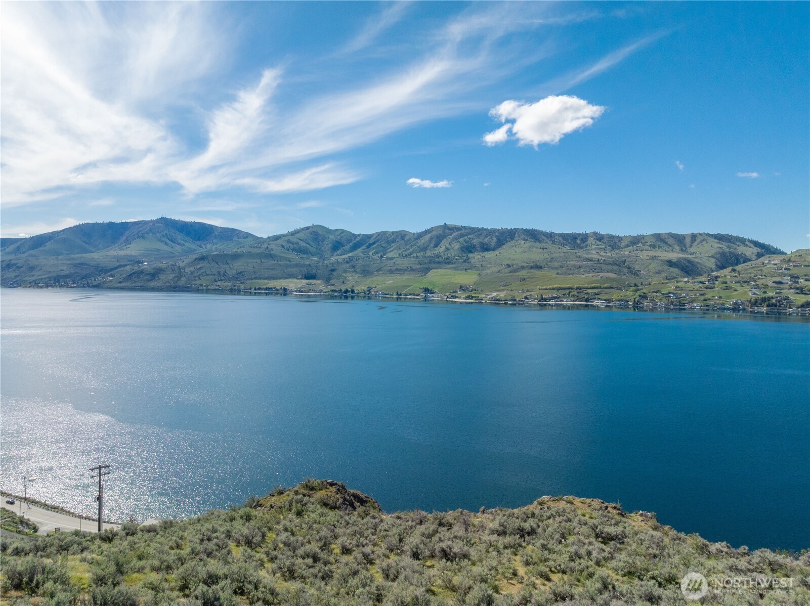 0 Rocky Point Lane Manson, WA 98831 - Photo 11 of 20 a view of a lake and a mountain