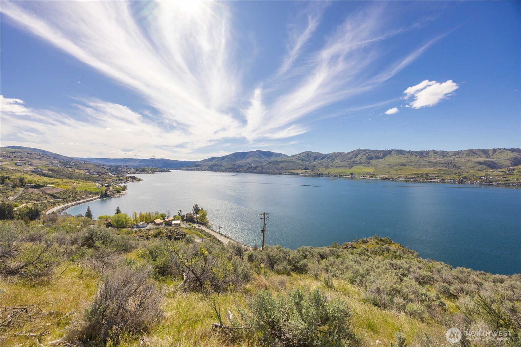 0 Rocky Point Lane Manson, WA 98831 - Photo 12 of 20 a view of a lake with a mountain in the background